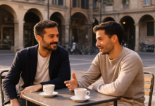 Two Italian men talking at a café table outdoors