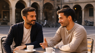 Two Italian men talking at a café table outdoors